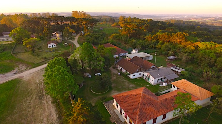 Drone view of ELAA's facilities: classrooms on the right, occupying the building of a large estate that was expropriated to settle MST landless farmers, and now known as Contestado Settlement. To the left are the dining halls and student housing. Image courtesy of Wellington Lenon/ELAA.
